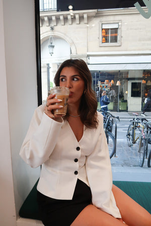 Sophia Long Sleeve Top White by Sneaky Link, chic cropped fit with black buttons, perfect for styling with denim or tailored pants.