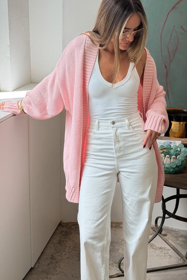 The Loren Oversized Knit Cardigan in Pink by Sneaky Link features a soft cotton wool knit, relaxed oversized fit, and cosy drape that layers effortlessly over everyday outfits.