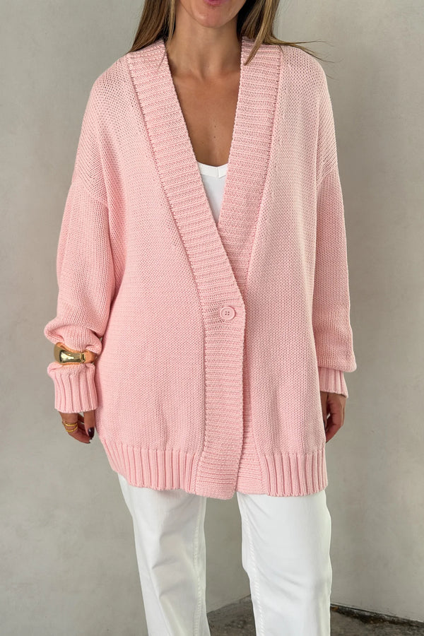 The Loren Oversized Knit Cardigan in Pink by Sneaky Link features a soft cotton wool knit, relaxed oversized fit, and cosy drape that layers effortlessly over everyday outfits.
