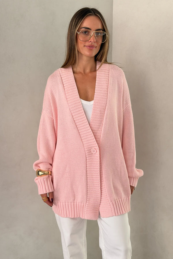 The Loren Oversized Knit Cardigan in Pink by Sneaky Link features a soft cotton wool knit, relaxed oversized fit, and cosy drape that layers effortlessly over everyday outfits.