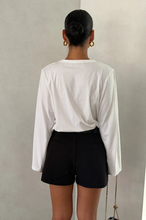 The Carter V Neck Long Sleeve Top by Sneaky Link is a breathable 100% cotton essential with a flattering V neckline and easy fit that pairs effortlessly with denim, tailoring, or layers.