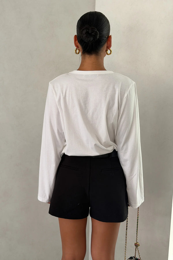 The Carter V Neck Long Sleeve Top by Sneaky Link is a breathable 100% cotton essential with a flattering V neckline and easy fit that pairs effortlessly with denim, tailoring, or layers.