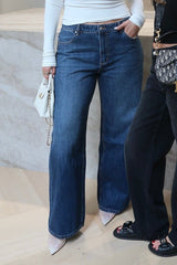 Elisha Baggy Jean Indigo by Sneaky Link, relaxed mid-rise baggy jeans in 100% cotton with branded details. Runs big; size down if unsure.