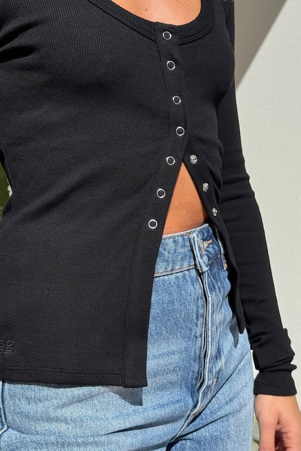 Lottie Long Sleeve Top Black by Sneaky Link – Soft cotton blend top with scoop neckline and snap button detail. Perfect for chic layering and viral winter style.