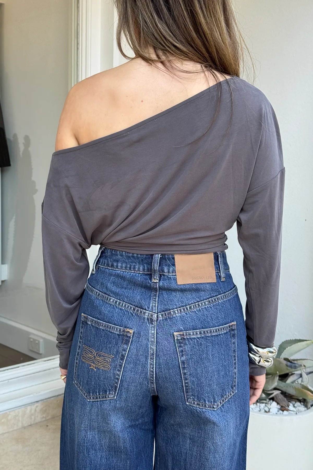 Dee Top by Sneaky Link, off-shoulder top in a soft viscose blend with dolman sleeves and gathered waist for an effortlessly chic look.