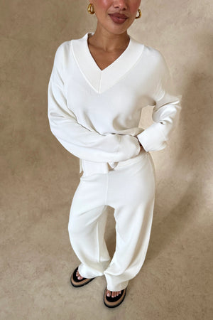 Lilly Sweater by Sneaky Link, oversized boxy viscose blend sweater with V-neck, ribbed hems and cuffs for effortless layering.