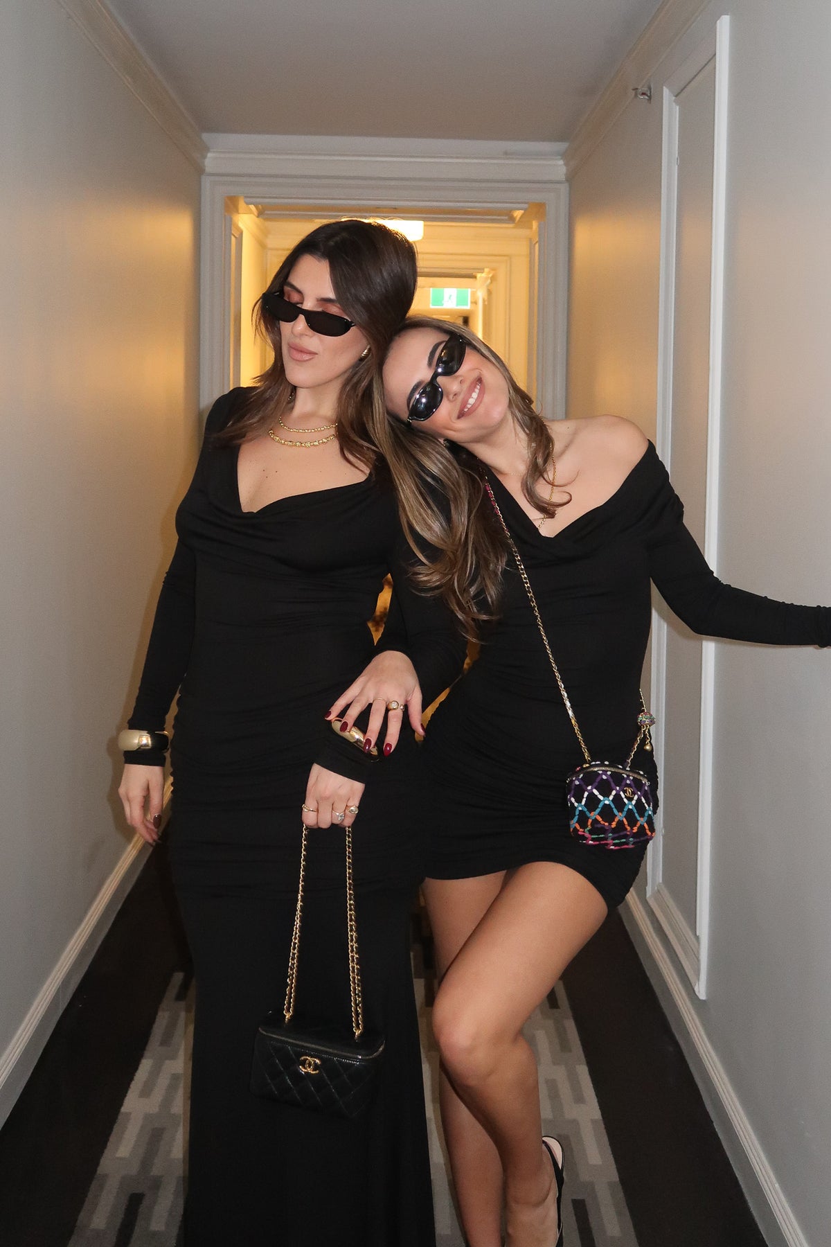 Hunter Long Sleeve Mini Dress Black by Sneaky Link, a sleek and figure-hugging mini with a dramatic cowl neckline, draped waist detail, and long sleeves — perfect for confident nights out.