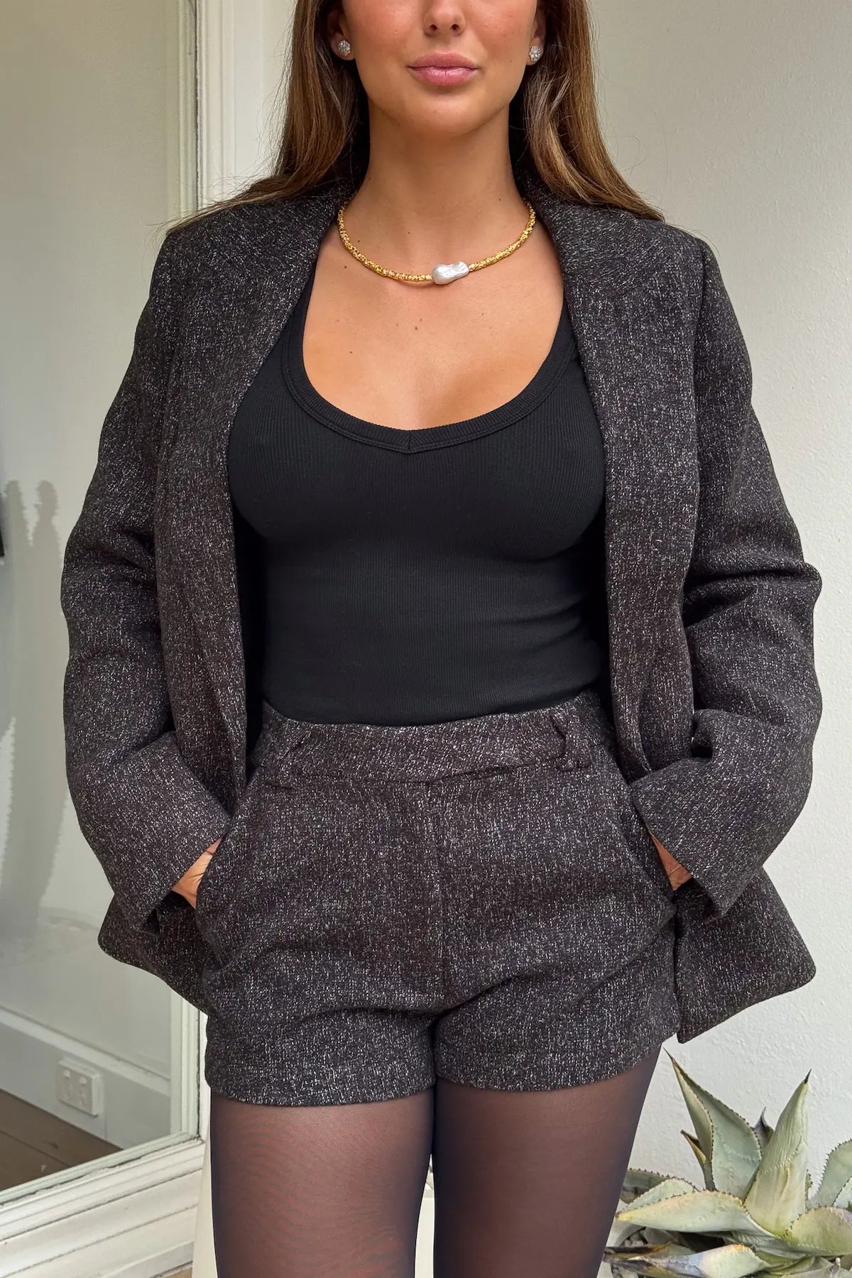 Gretta Short Black Marle by Sneaky Link, tailored mini with subtle A-line, textured poly fabric, perfect with matching blazer for polished layering.