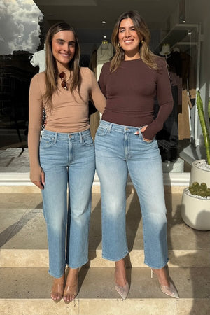 The Rambler Zip Ankle Look Ma, No Hands! by MOTHER, trendy high-waisted jeans with a wide leg and ankle cut. Perfect for a relaxed, stylish look with light-blue whiskering and fading.