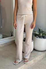 Charlie Pant Sand/White by Sneaky Link, trendy and comfortable low-rise pants with elastic waist and contrast drawcord, perfect for chic summer days and evenings.