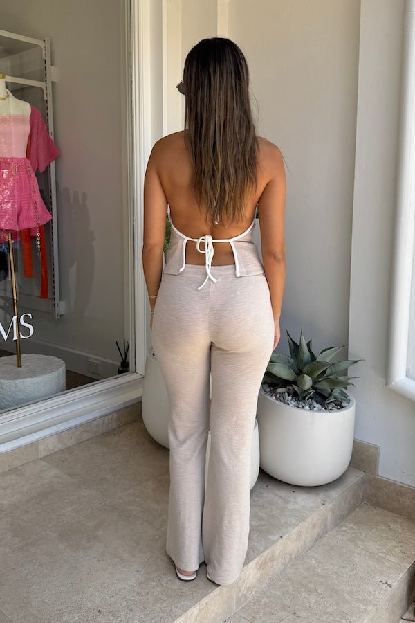 Charlie Pant Sand/White by Sneaky Link, trendy and comfortable low-rise pants with elastic waist and contrast drawcord, perfect for chic summer days and evenings.