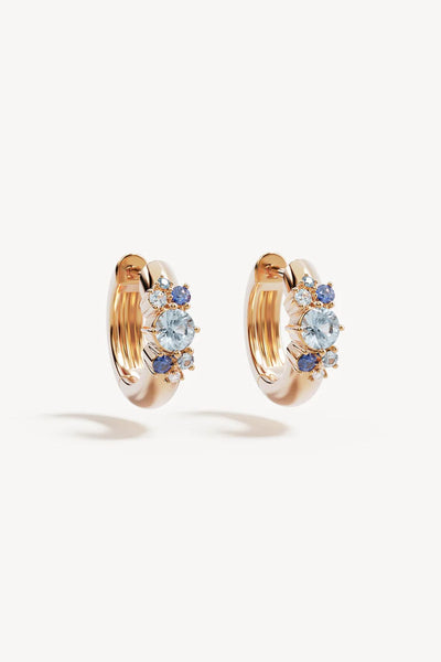 I Breathe, I Become Hoops by By Charlotte – 18k gold vermeil huggie earrings with aquamarine, sapphire and tourmaline stones.