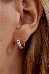 I Breathe, I Become Hoops by By Charlotte – 18k gold vermeil huggie earrings with aquamarine, sapphire and tourmaline stones.