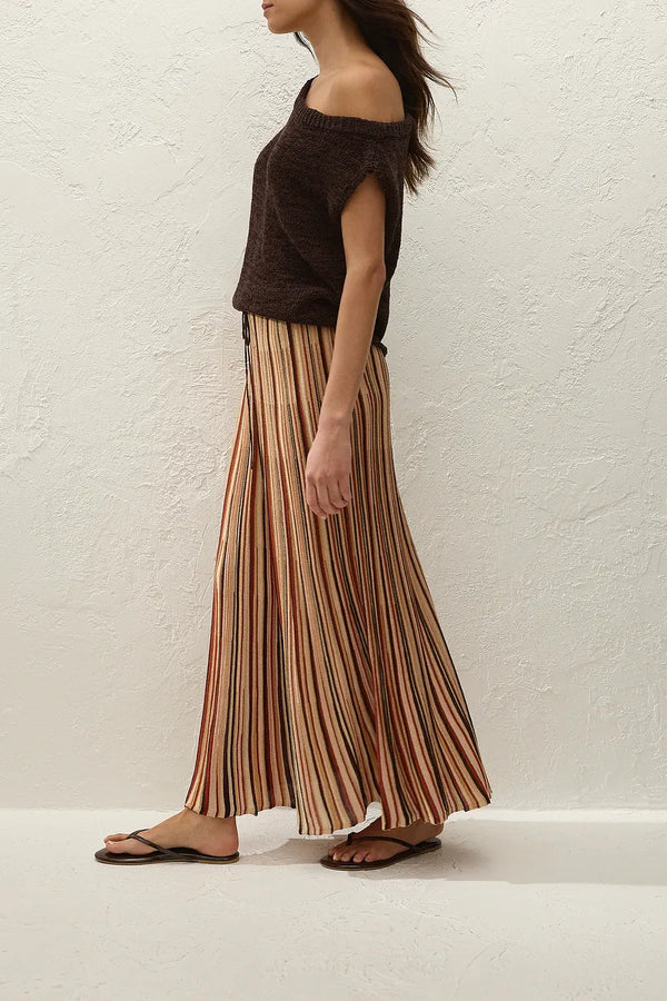 Iden Maxi Skirt in Murano Stripe by Faithfull the Brand, a flared knit midi skirt with drawstring waist and metallic stripe detailing.