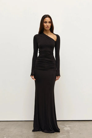 Inaya Maxi Dress Shadow by Bayse – asymmetrical maxi dress with ruched waist and long fitted sleeves.