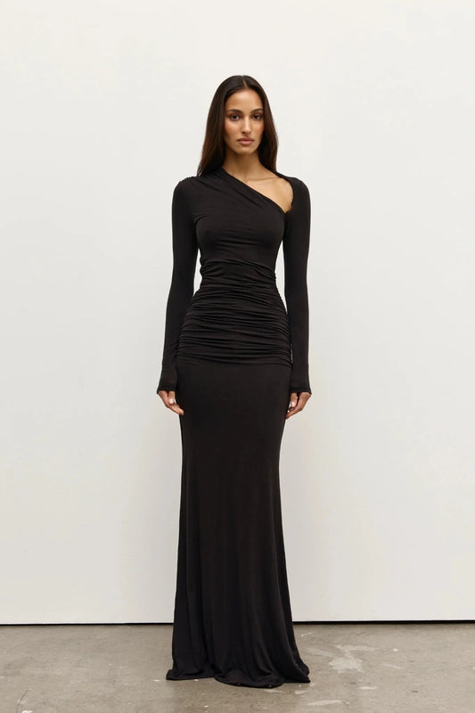 Inaya Maxi Dress Shadow by Bayse – asymmetrical maxi dress with ruched waist and long fitted sleeves.