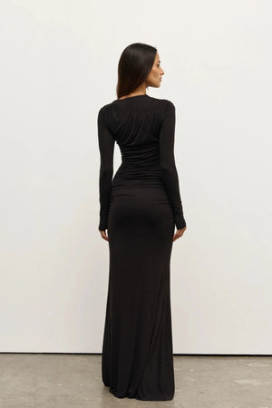 Inaya Maxi Dress Shadow by Bayse – asymmetrical maxi dress with ruched waist and long fitted sleeves.