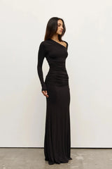 Inaya Maxi Dress Shadow by Bayse – asymmetrical maxi dress with ruched waist and long fitted sleeves.