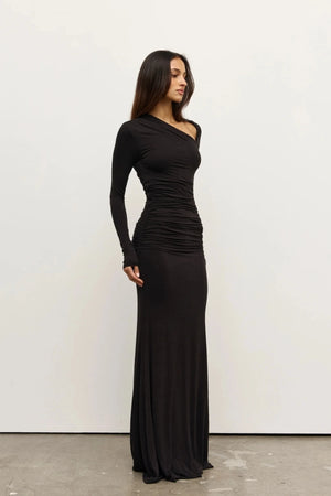 Inaya Maxi Dress Shadow by Bayse – asymmetrical maxi dress with ruched waist and long fitted sleeves.