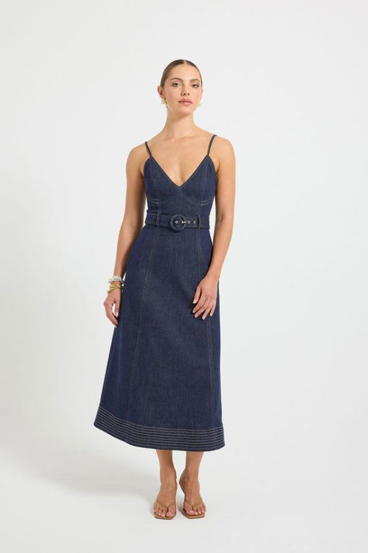 Indie Flared Midi in Indigo Denim by Pasduchas, a stretch denim midi with V-neckline, flared hem, contrast topstitching, and removable belt for tailored finish.
