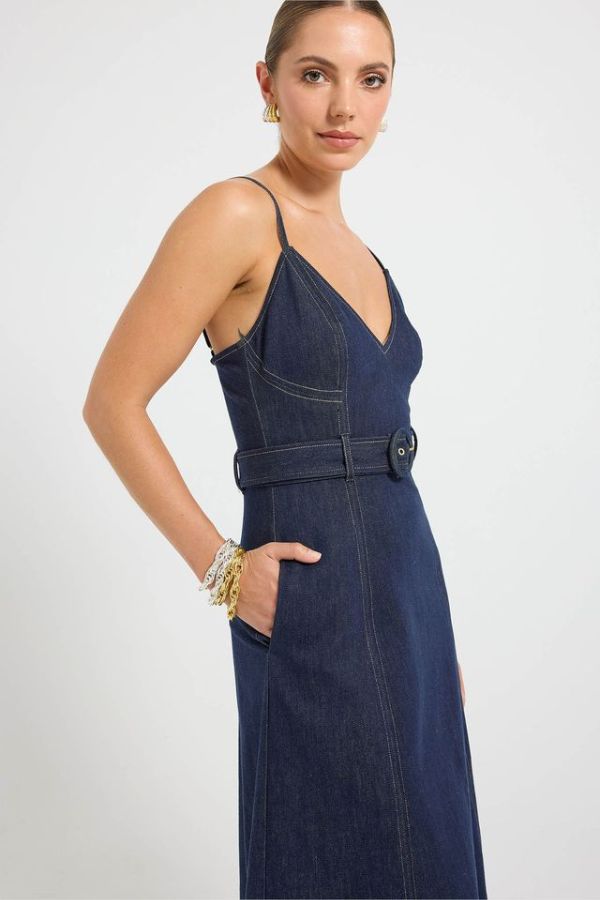 Indie Flared Midi in Indigo Denim by Pasduchas, a stretch denim midi with V-neckline, flared hem, contrast topstitching, and removable belt for tailored finish.
