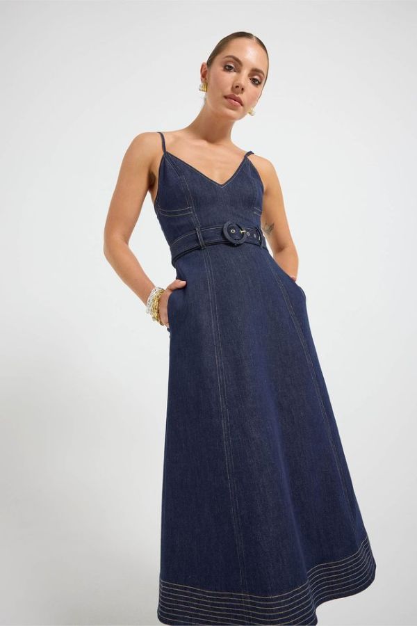 Indie Flared Midi in Indigo Denim by Pasduchas, a stretch denim midi with V-neckline, flared hem, contrast topstitching, and removable belt for tailored finish.
