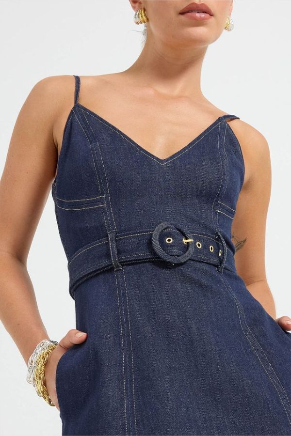 Indie Flared Midi in Indigo Denim by Pasduchas, a stretch denim midi with V-neckline, flared hem, contrast topstitching, and removable belt for tailored finish.
