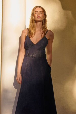 Indie Flared Midi in Indigo Denim by Pasduchas, a stretch denim midi with V-neckline, flared hem, contrast topstitching, and removable belt for tailored finish.

