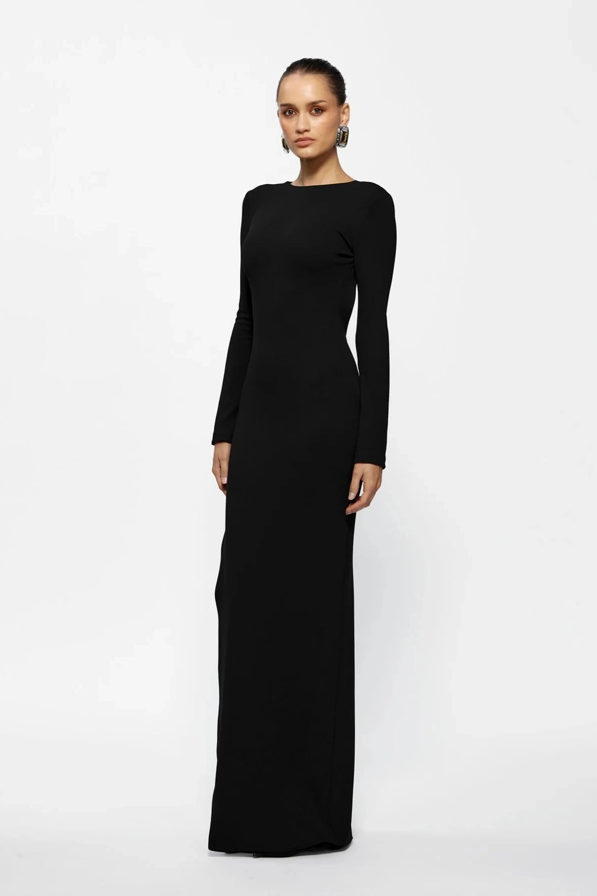 Indie Gown Black by Effie Kats – Long-sleeve stretch crepe gown with dramatic open back, designed to flatter with timeless elegance.