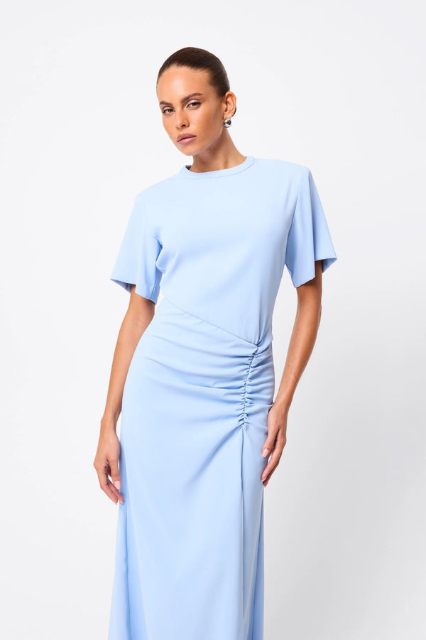 Infusion Maxi Dress in Blue by Mossman, a fluid crew-neck maxi with asymmetric ruching and short sleeves for refined yet modern daytime elegance.