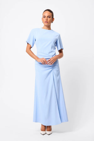 Infusion Maxi Dress in Blue by Mossman, a fluid crew-neck maxi with asymmetric ruching and short sleeves for refined yet modern daytime elegance.