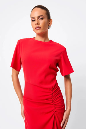 Infusion Maxi Dress in Red by Mossman, a refined crew-neck maxi with asymmetric ruching and fluid drape for effortless day-to-evening elegance.