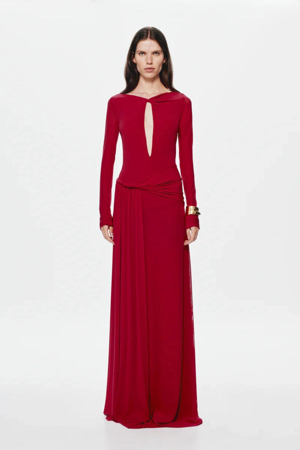 Irina Long Sleeve Dress Cherry by Misha, mesh maxi with twist details and waterfall sash, perfect for elegant evenings or bold events.
