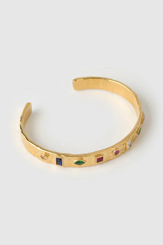 Isabella Gold Cuff by Arms of Eve – textured 14K gold PVD cuff with coloured zircon stone detailing.