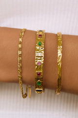 Isabella Gold Cuff by Arms of Eve – textured 14K gold PVD cuff with coloured zircon stone detailing.