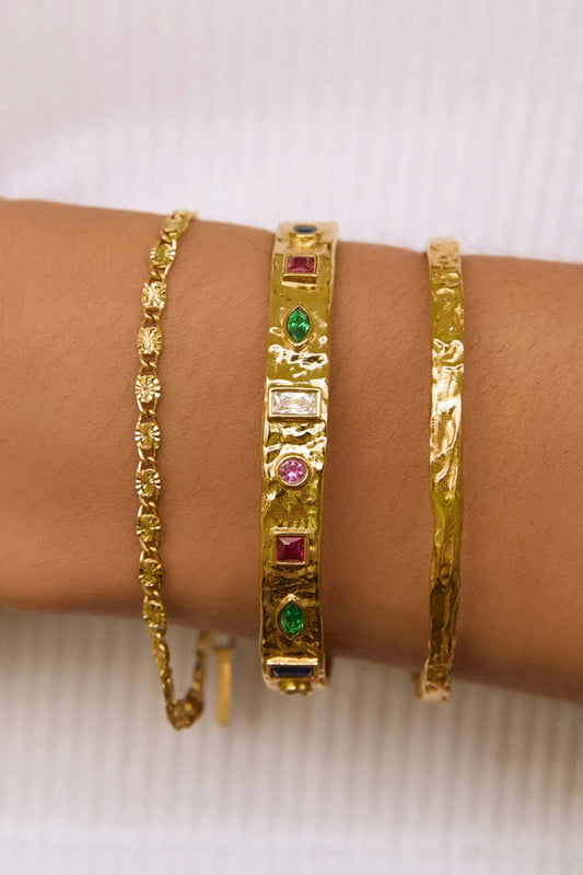 Isabella Gold Cuff by Arms of Eve – textured 14K gold PVD cuff with coloured zircon stone detailing.