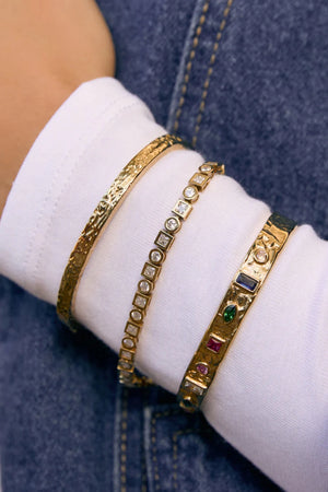 Isabella Gold Cuff by Arms of Eve – textured 14K gold PVD cuff with coloured zircon stone detailing.