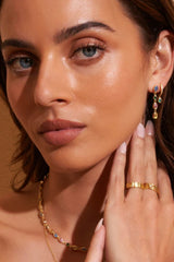 Isadora Earrings in Multi Blue by Arms Of Eve, drop-style earrings with blue-toned zircon stones on polished gold for a luxurious pop of colour.