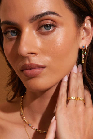 Isadora Earrings in Multi Blue by Arms Of Eve, drop-style earrings with blue-toned zircon stones on polished gold for a luxurious pop of colour.