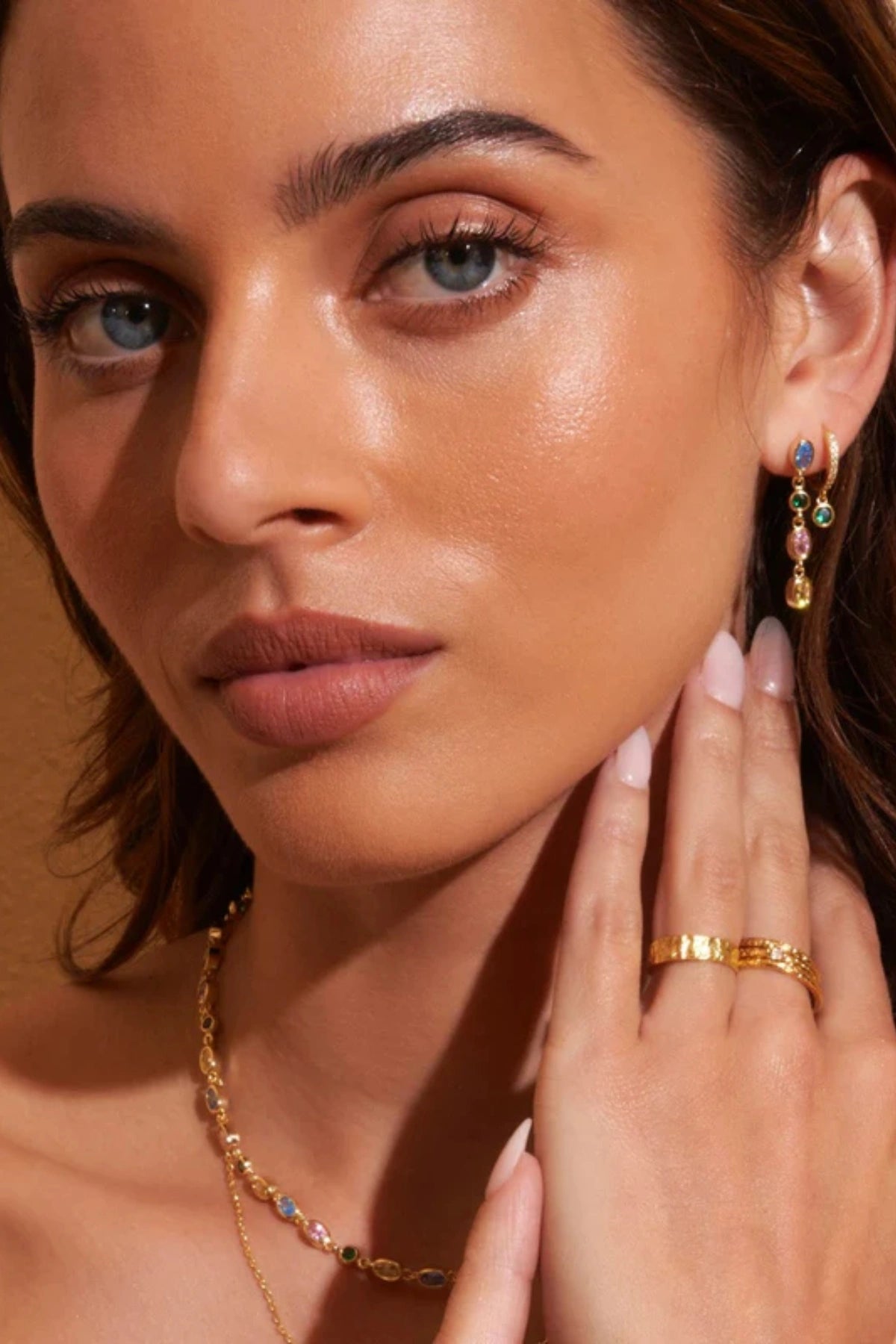 Isadora Earrings in Multi Blue by Arms Of Eve, drop-style earrings with blue-toned zircon stones on polished gold for a luxurious pop of colour.