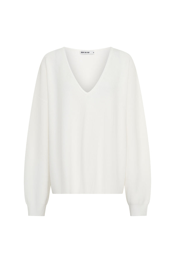 Jaz Oversized V Neck Knit Sweater in White with a deep V neckline and relaxed slouchy fit, creating a soft draped silhouette with a clean, oversized finish.