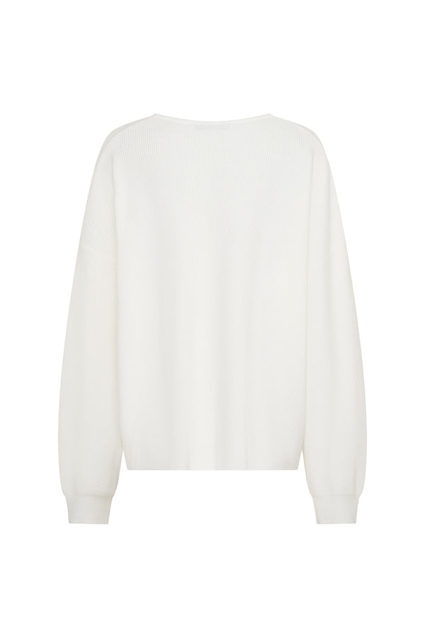 Jaz Oversized V Neck Knit Sweater in White with a deep V neckline and relaxed slouchy fit, creating a soft draped silhouette with a clean, oversized finish.