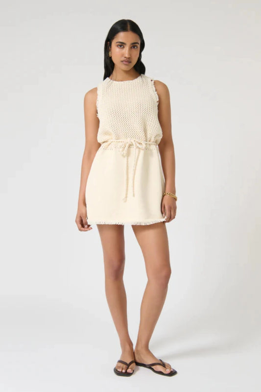 Jana Dress – Ivory by Onte, contrast-knit mini with fringe and rope tie. Perfect for summer days or elevated resort styling.