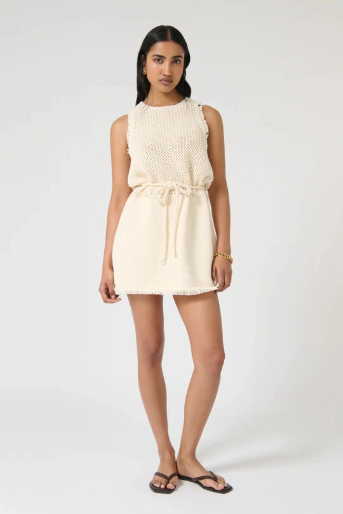 Jana Dress – Ivory by Onte, contrast-knit mini with fringe and rope tie. Perfect for summer days or elevated resort styling.