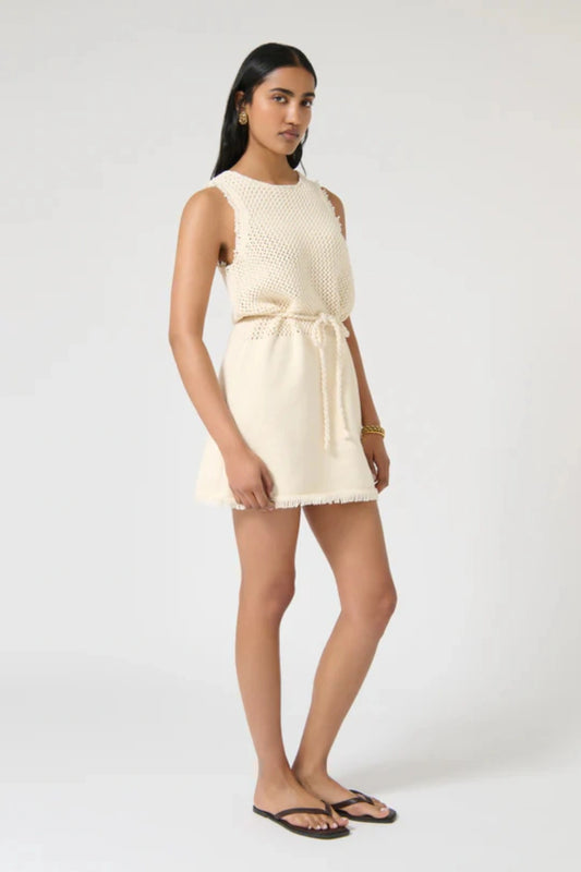 Jana Dress – Ivory by Onte, contrast-knit mini with fringe and rope tie. Perfect for summer days or elevated resort styling.