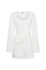 Jaz Long Sleeve Knot Mini Dress in White with a soft front knot, sculpted waist, and gentle ruching that creates a smooth, body hugging silhouette with a clean, elevated finish.