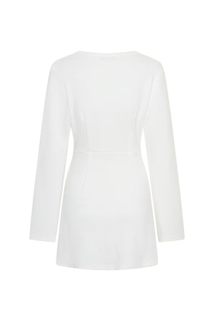Jaz Long Sleeve Knot Mini Dress in White with a soft front knot, sculpted waist, and gentle ruching that creates a smooth, body hugging silhouette with a clean, elevated finish.