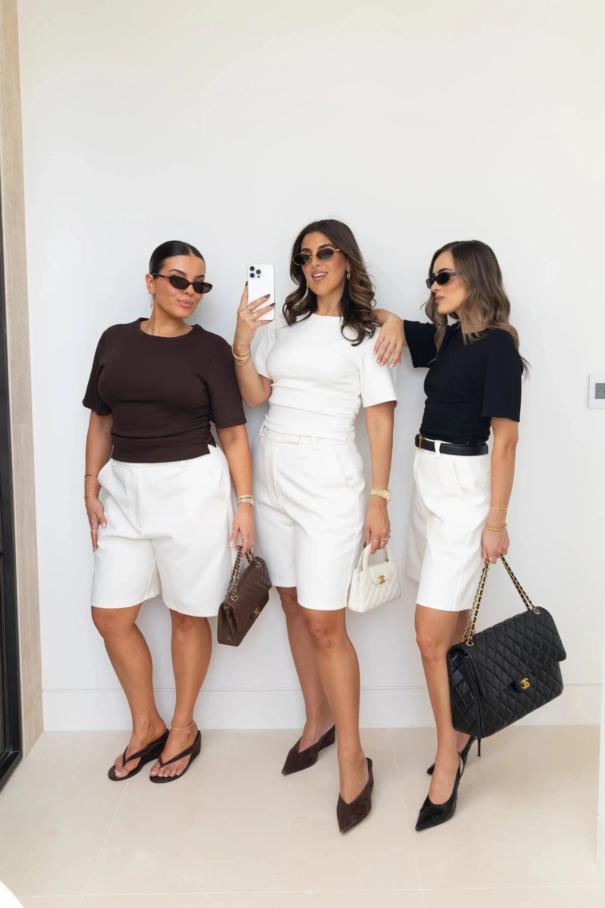 Jaz Hand Ruched Tee in White by Sneaky Link, featuring short sleeves, ruched waist detail, and sculpted fit for elevated everyday style.