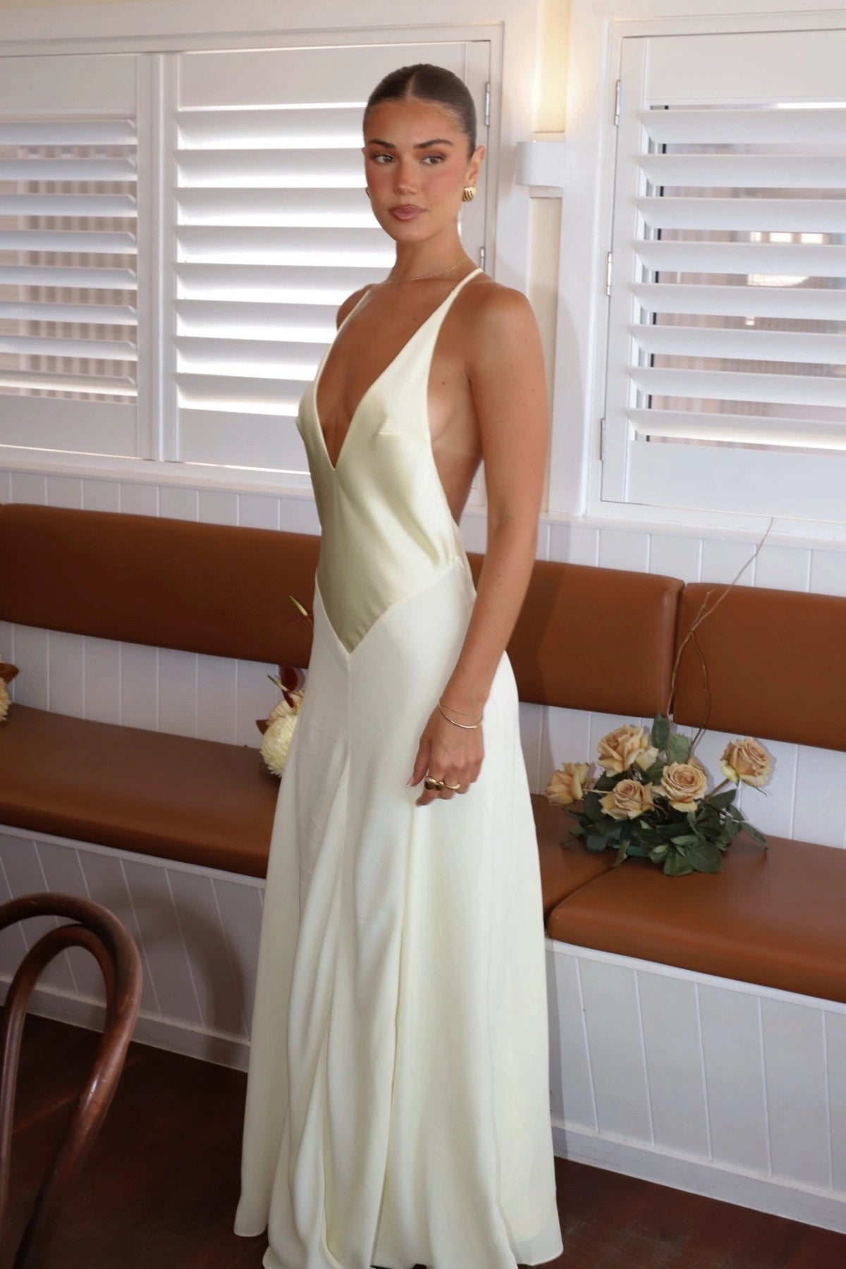 Jaz Hand V-Neck Maxi Dress in Butter by Sneaky Link, a flowing one-shoulder silhouette in soft yellow. Perfect for summer events or weddings.
