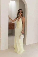 Jaz Hand V-Neck Maxi Dress in Butter by Sneaky Link, a flowing one-shoulder silhouette in soft yellow. Perfect for summer events or weddings.
